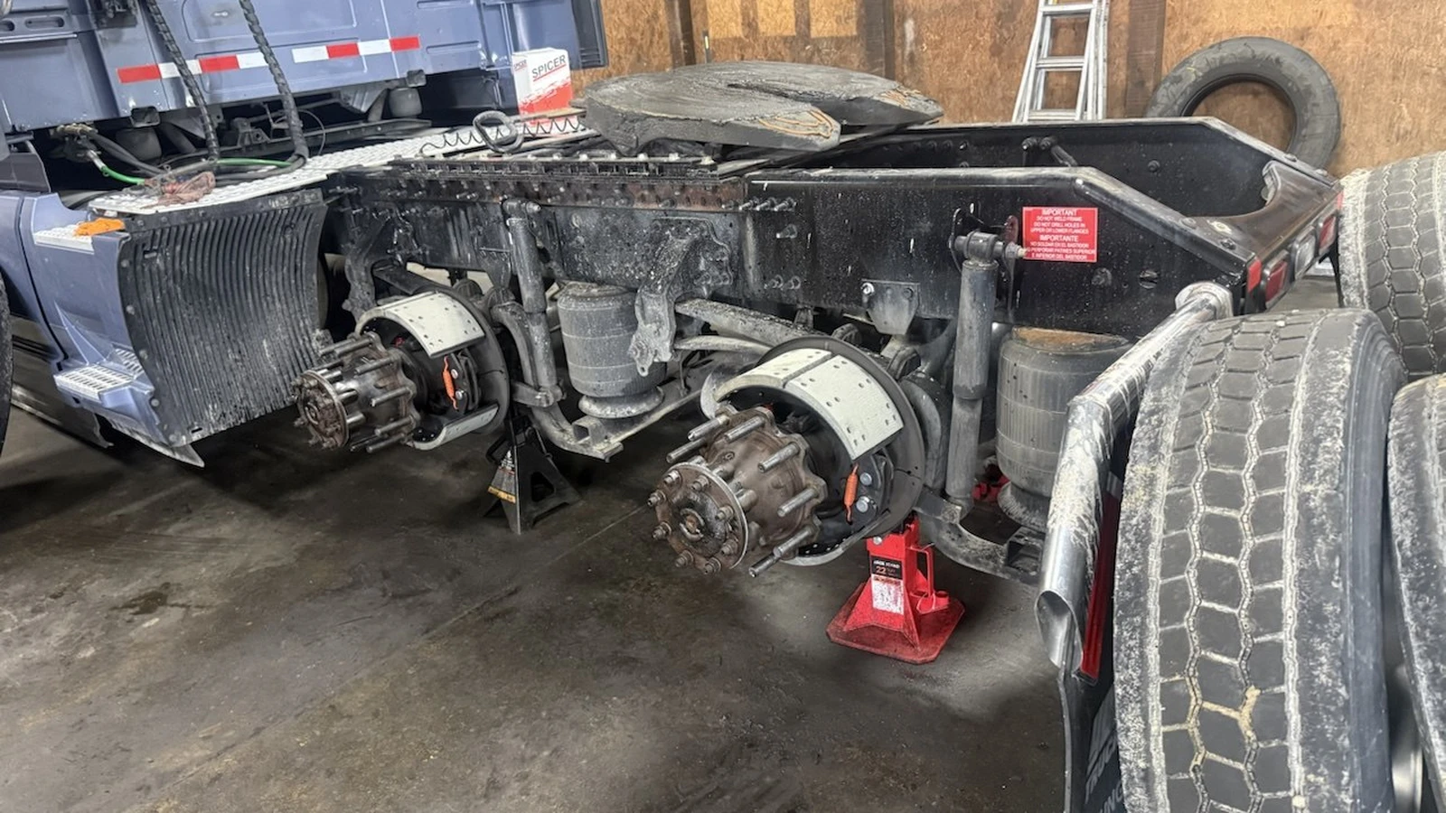 Drive axle, brakes and air suspension work on a tractor